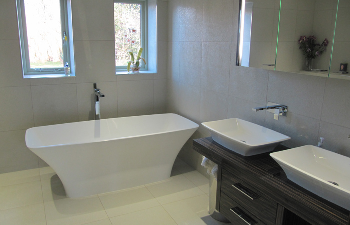 detached-house-harrogate-gallery-5 tiled-bathroom-with-free-standing-white-bath-and-double-sink-unit
