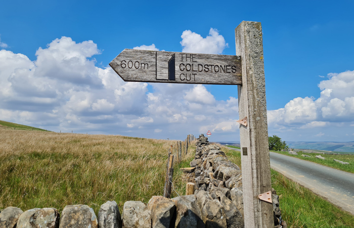wooden-signpost-in-countryside